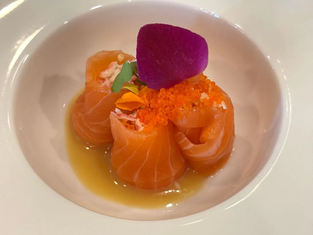 Salmon rolls filled with crab, topped with roe and flower petal at The Shoya, a Japanese Restaurant in Pleasant Hill