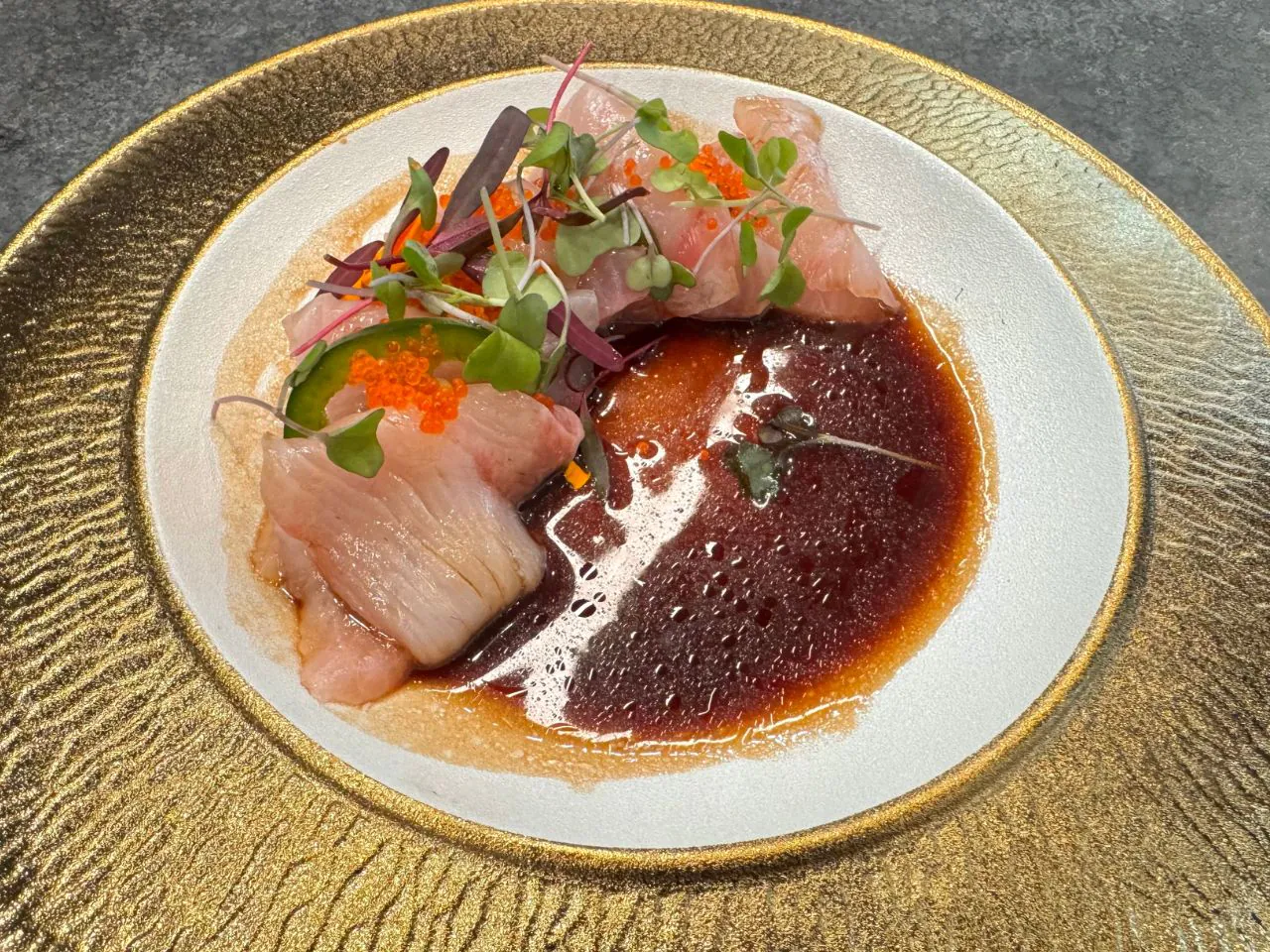 Fresh fish crudo with vibrant sauce and microgreens at The Shoya, a Japanese Restaurant in Pleasant Hill